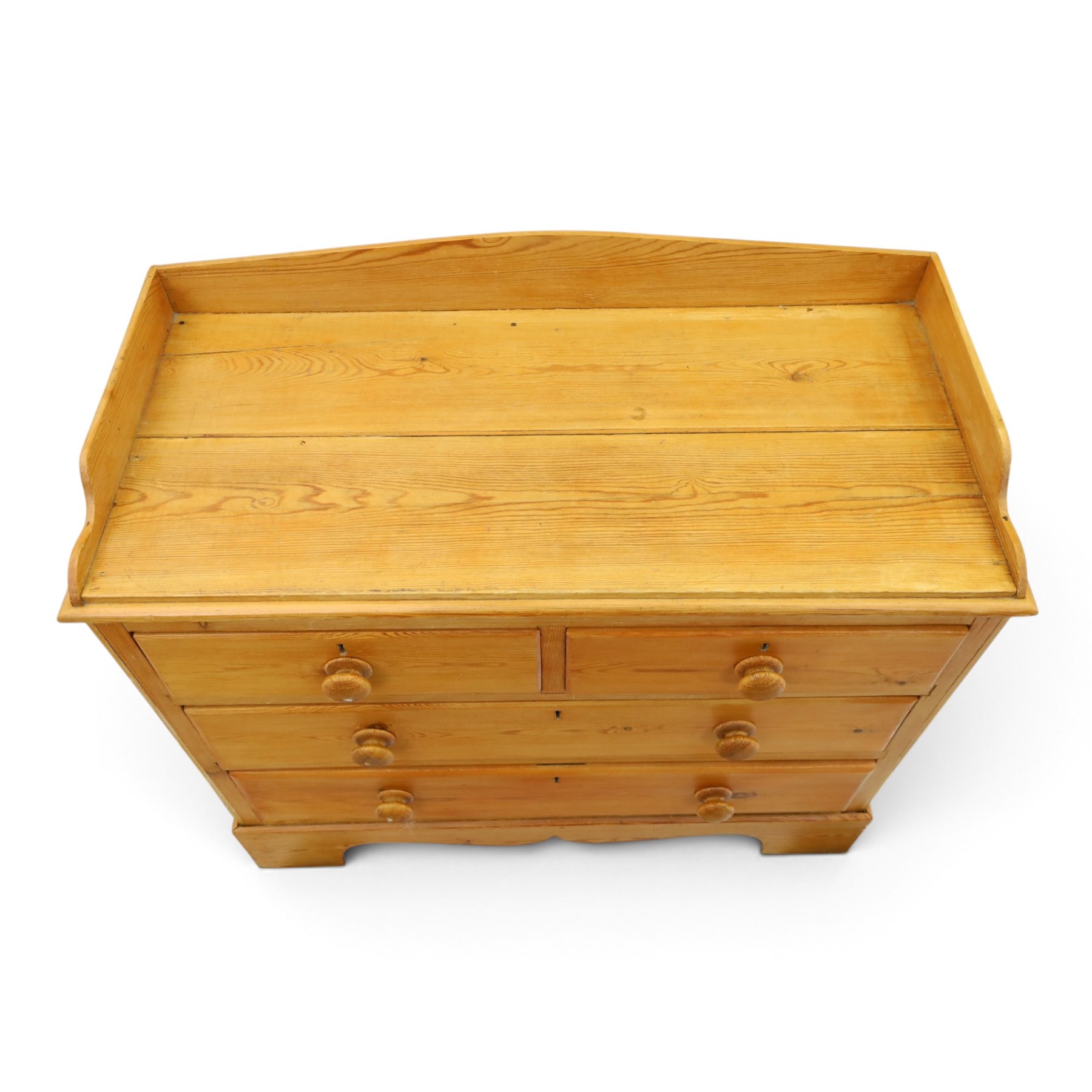 Victorian pine chest, galleried three quarter top, fitted with two short and two long drawers. with shaped apron and supports