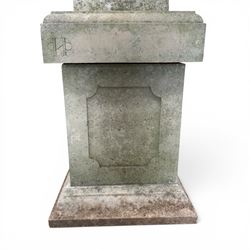 Pair of weathered cast stone Neoclassical design garden Kylix shape urns, foliate moulded rim over a gadrooned underbelly, the scalloped socle over a rectangular pedestal with faux-panelled sides, stamped with stylised ‘H’ monogram