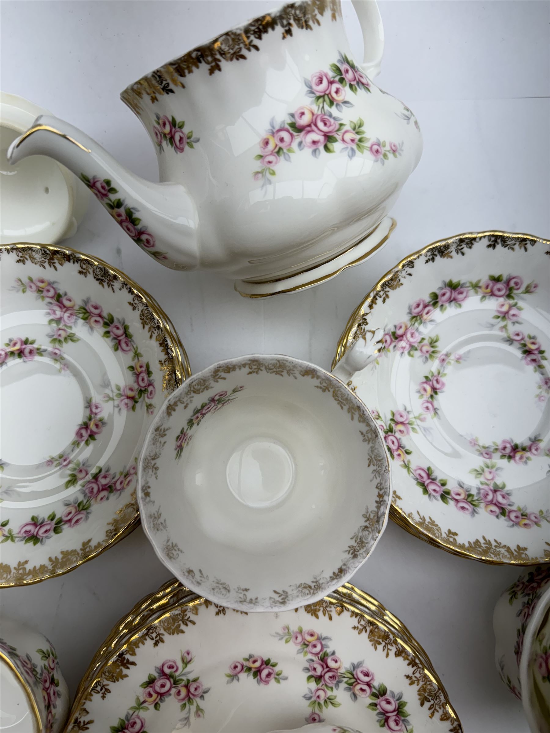 Royal Albert Dimity Rose pattern tea service for six place settings, including teapot, teacups and saucers, sugar bowl and two milk jugs, all with printed mark beneath