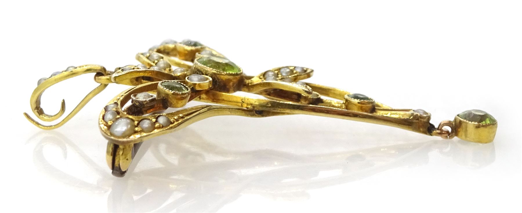Edwardian Art Nouveau gold peridot and seed pearl pendant/brooch, stamped 9ct, boxed