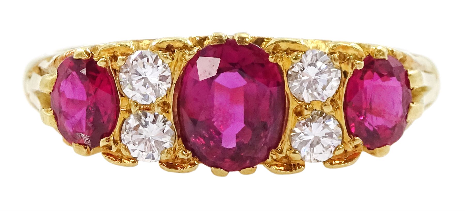 18ct gold three stone oval cut ruby and four stone round brilliant cut diamond ring, Birmingham 1972
