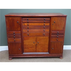 Edwardian mahogany specimen cabinet, moulded top, six long and eight graduating drawers, four single cupboards, one double cupboard, bun feet, W124cm, H101cm, D50cm  