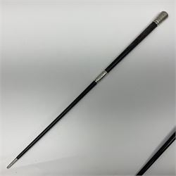 Two early 20th century conductor's ebonised batons each with three silver mounts; one hallmarked London 1915 with presentation plaque 'I.O.R. Presented to Mr. J.R. Maddock 4.1.17' L52cm; the other hallmarked Chester 1908 with vacant cartouche L51.5cm (2)