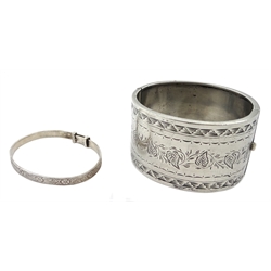 Silver bangle by Henry Griffith & Sons Ltd, Birmingham 1957, three other silver bangles stamped or hallmarked and a silver purse by Ellis Bros, stamped sterling