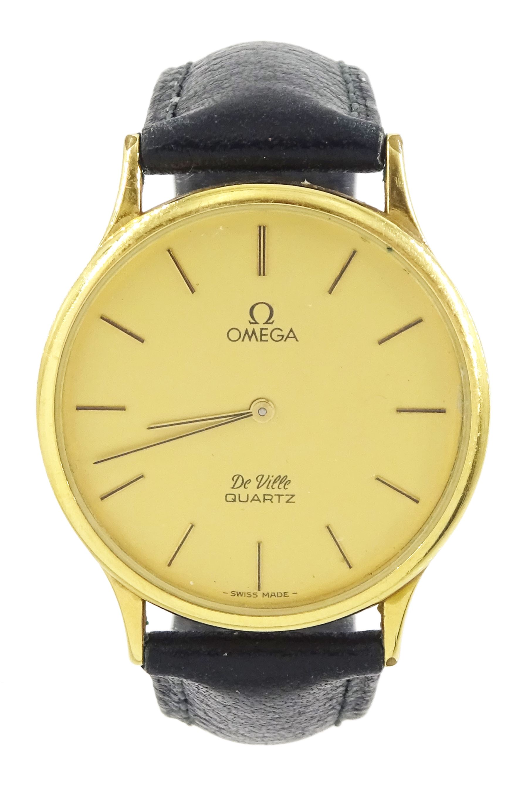 Omega De Ville gentleman's gold-plated and stainless steel quartz wristwatch, Ref. 1365, champagne dial with baton hour markers, on black leather strap, with Omega buckle