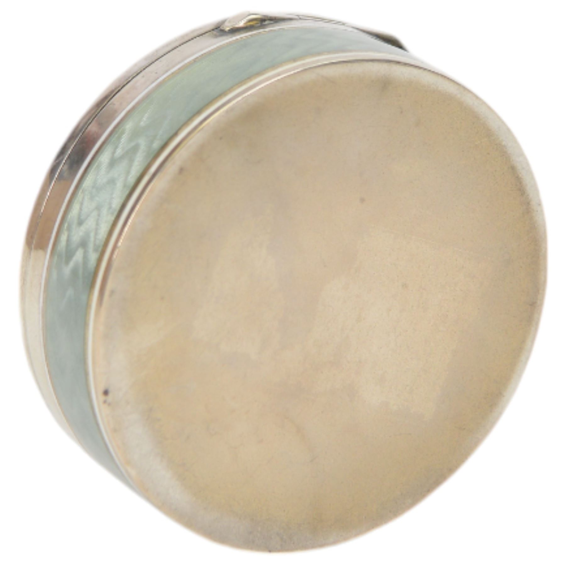 Early 20th century silver and guilloche enamel trinket box, of circular form, decorated throughout with pale green guilloche enamel and a floral wreath to the hinged cover, opening to reveal a gilt interior with personal engraving, import marks for Erich Kellerman, London 1909, D6cm