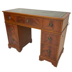 Music system in the form of a Georgian design twin pedestal desk, the reed moulded rectangular top hinges to reveal Garrard turntable with Dynatron Amplifier, fitted with speakers enclosed by two doors disguised as drawers, on bracket feet