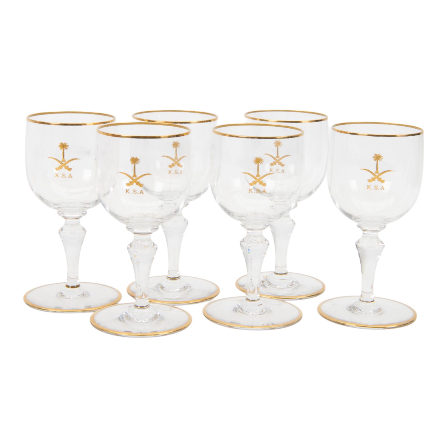 Baccarat decanter, six wine glass and six port glasses,  all with a gilt band to the rim and foot and motif for Kingdom of Saudi Arabia