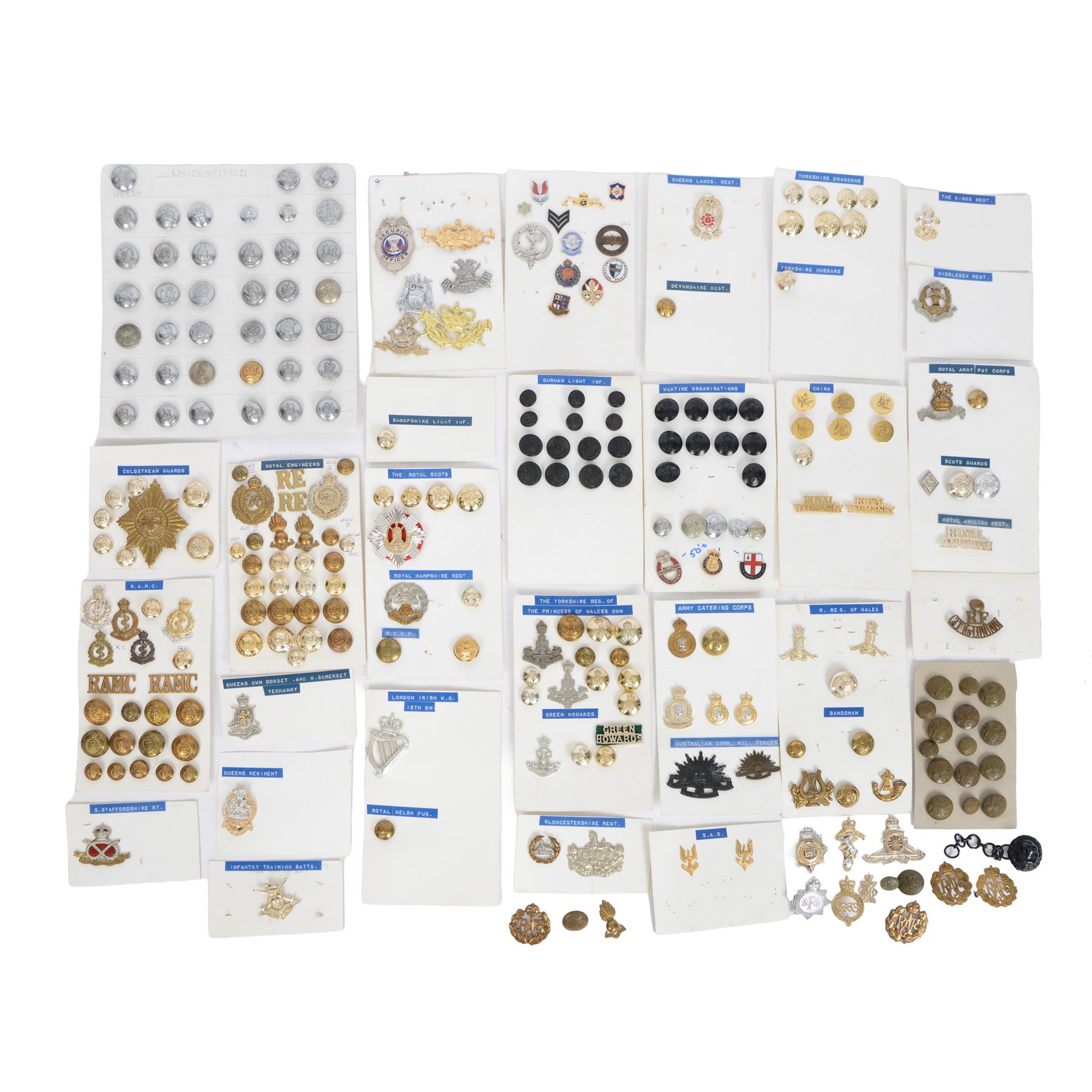 Collection of military cap badges, buttons and similar, including examples for Royal Army Medical Corps, Royal Army Pay Corps, Royal Engineers etc 