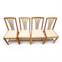 Knightman - set of nine cherrywood dining chairs, with fan splat backs and upholstered seats, raised on square legs joined by stretchers, comprising chairs of slight differing widths and one chair with turned front legs and orange upholstery and no Knight carving, the rest with recessed carved knight trademark, by Horace Knight of Old Mill Furniture, Balk near Thirsk 