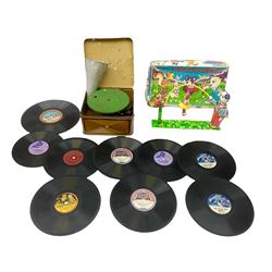 Gebruder Bing Germany Pigmyphone child's portable toy gramophone in woodgrain finish tin-plate box with key and tin of needles L15cm; and nine small records of nursery rhymes; together with a Japanese tin-pate 'Skip Rope Animals' clockwork toy, boxed.