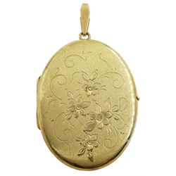 9ct gold locket pendant, with engraved foliate decoration by Mappin & Webb, London import marks 1979