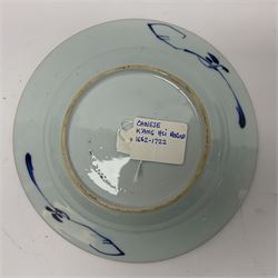 Japanese Meiji period Arita blue and white plate, of circular form, painted with riverside landscape and bird upon flowering branch, with character mark beneath, D24.5cm, together with two 18th century Chinese blue and white plates, each painted with floral design, each approximately D22.5cm