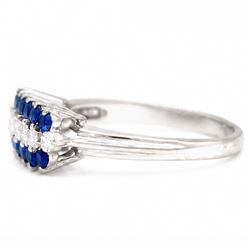 White gold diamond and sapphire three row ring, eight round brilliant cut diamonds, set between two rows of round cut sapphires, stamped 18ct, total diamond weight approx 0.30 carat