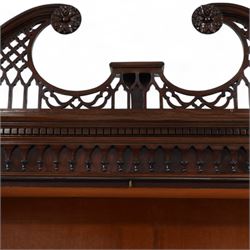 Large George III mahogany bookcase display cabinet, pierced swan neck pediment with floral head roundels over dentil and arcade frieze, enclosed by two geometric astragal glazed doors with lozenge motifs, the lined interior fitted with three shelves, gadrooned lower rail over acanthus carved cabriole supports with ball and claw feet 
