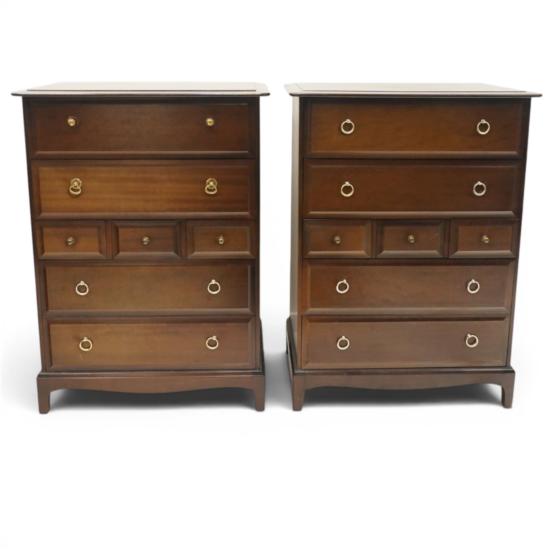 Stag Minstrel - pair of mahogany combination chests, fitted with an assortment of seven drawers with brass ring and pull handles, on bracket feet