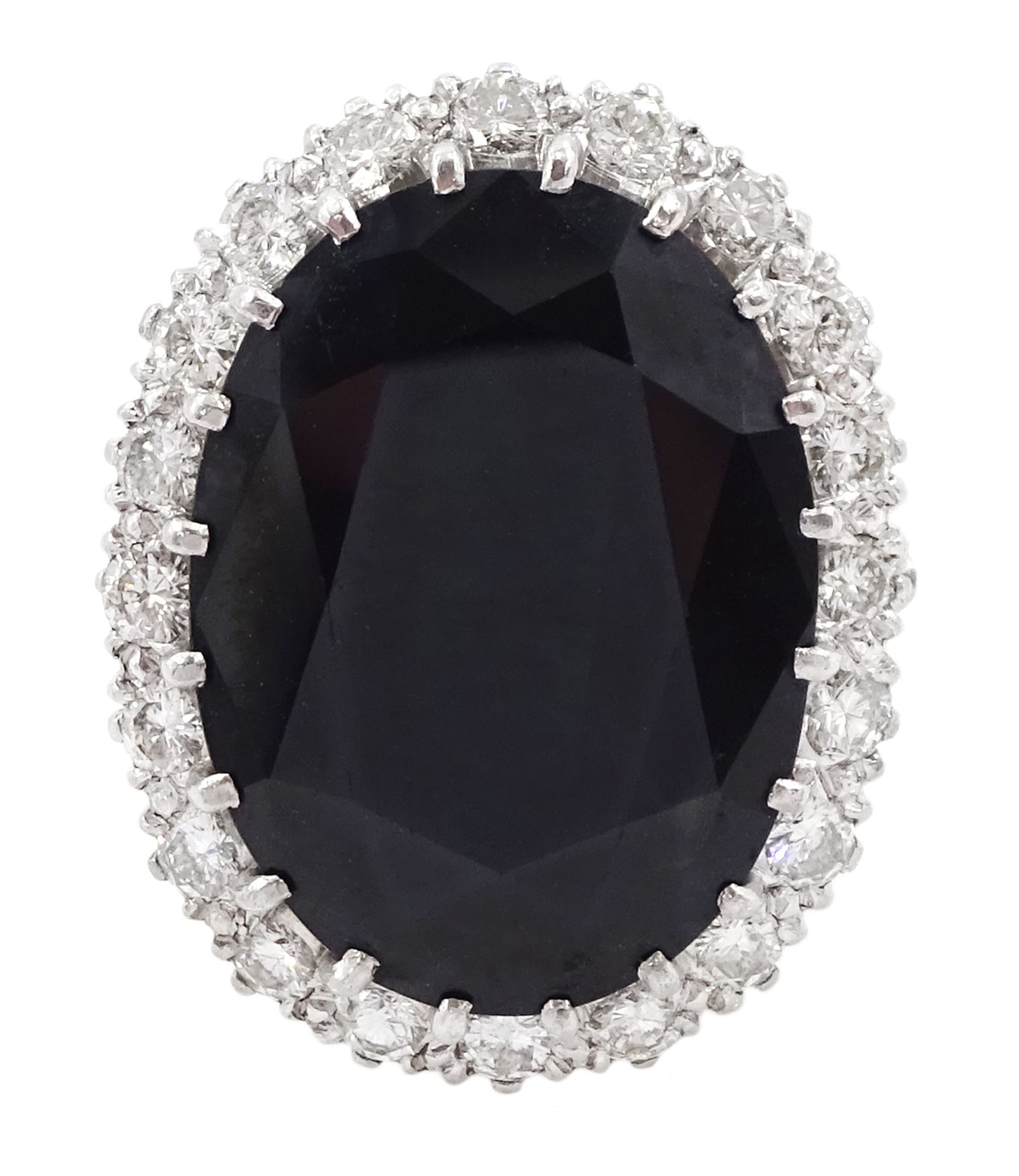 18ct white gold large oval sapphire and round brilliant cut diamond cluster ring, sapphire approx 27.35 carat, total diamond weight approx 1.00 carat