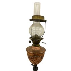Late 19th century black painted wrought metal standard lamp, telescopic column, copper reservoir