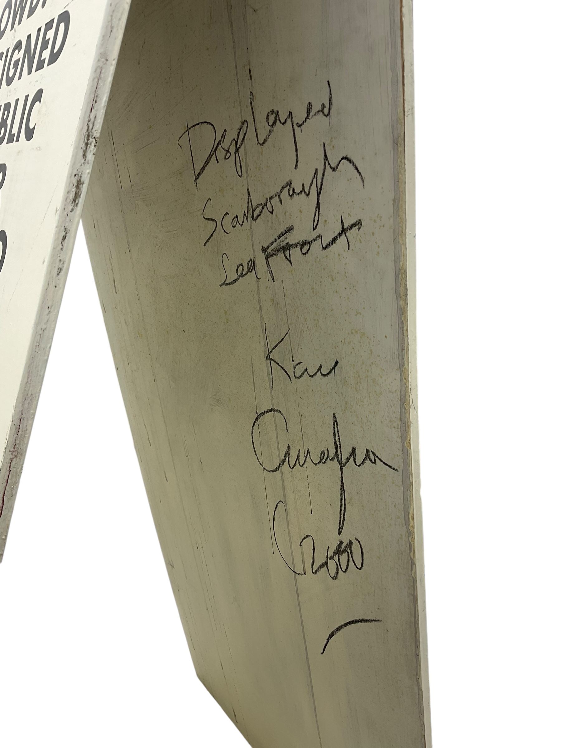 Kane Cunningham (British 1961-): 'The Crowd', painted wooden A-frame 122cm x 61cm