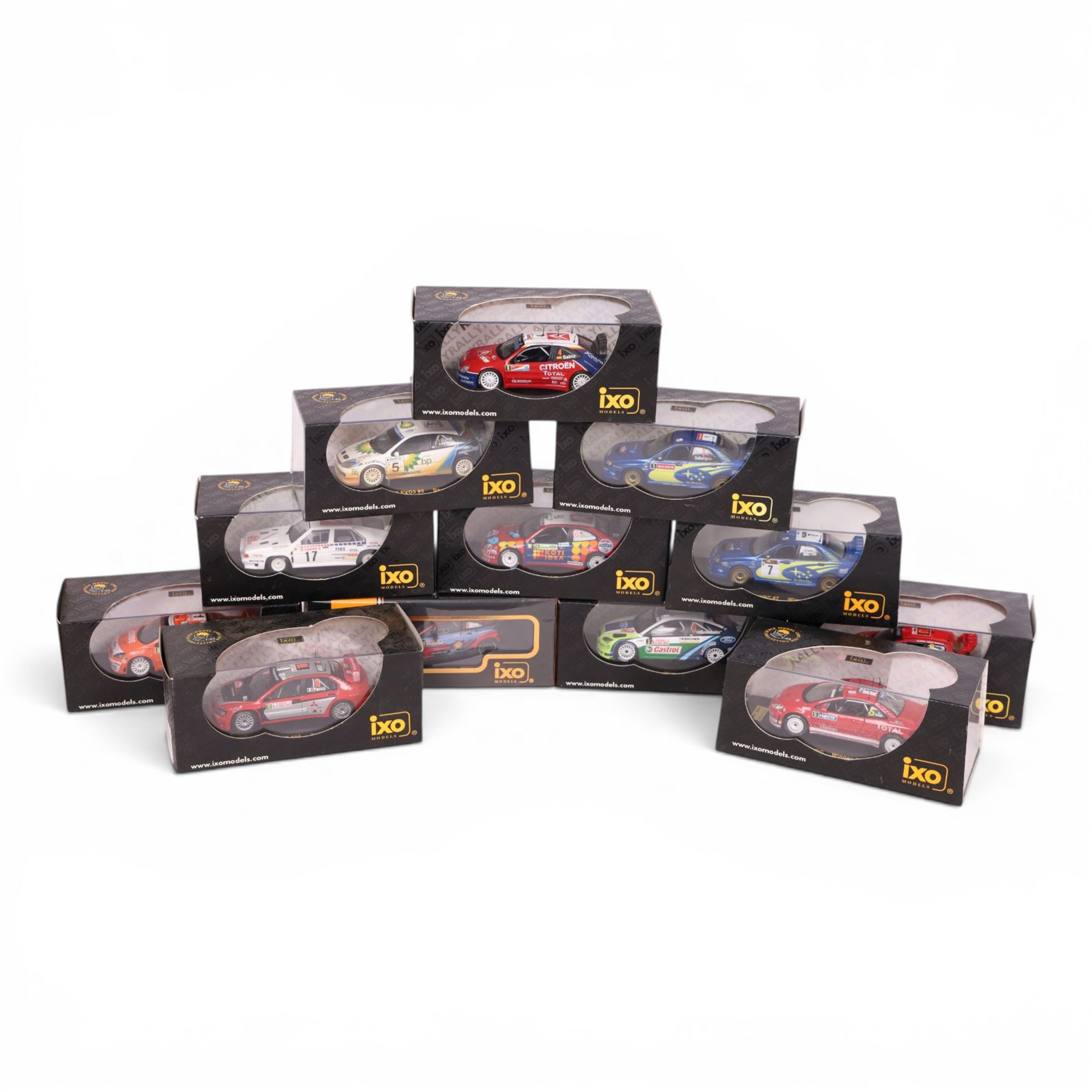 Twelve IXO Models 1:43 scale diecast model rally cars, comprising no. RAM118 Subaru Impreza WRC #7, no. RAM186 Peugeot 307 WRC, no. RAM154 Citroen Xsara WRC, no. RAM174 Peugeot 206, no. RAM227 Citroen Xsara WRC #16, no. RAM219 Ford Focus RS WRC #3, no. RAM713 Hyundai i20 Coupe WRC #19, no. RAM213 Peugeot 307 WRC #8, no. RAC069 Citroen BX 4TC #17, no. RAM162 Ford Focus WRC #5, no. RAM156 Subaru Impreza WRC #1 and no. RAM169 Mitsubishi Lancer WRC #10, all boxed