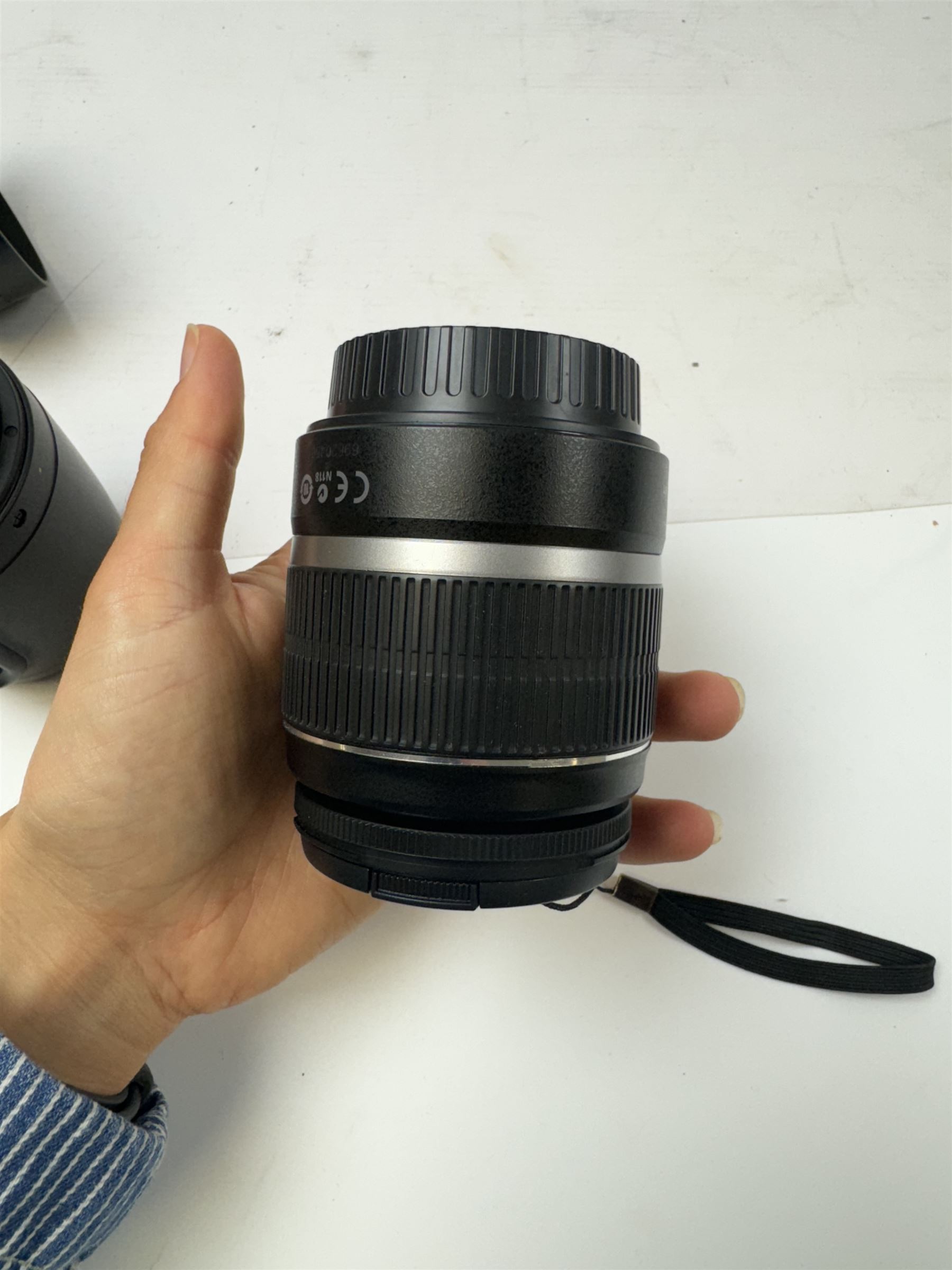 Six Canon camera lenses, to include EF 22-55mm 1;4-5.6 USM zoom lens serial no. 1507261, EF 35-105mm 1:3.5-4.5 zoom lens serial no. 1266383, EF-S 17-85mm 1:4-5.6 IS USM lens serial no. 8342906762, EF-S 18-55mm 1:3-5.6 IS zoom lens serial no. 6962045620, EF 35-80mm 1:4-5.6 power zoom lens serial no. 1903013B and AC 75-200mm 1:4.5 zoom lens serial no. 29445