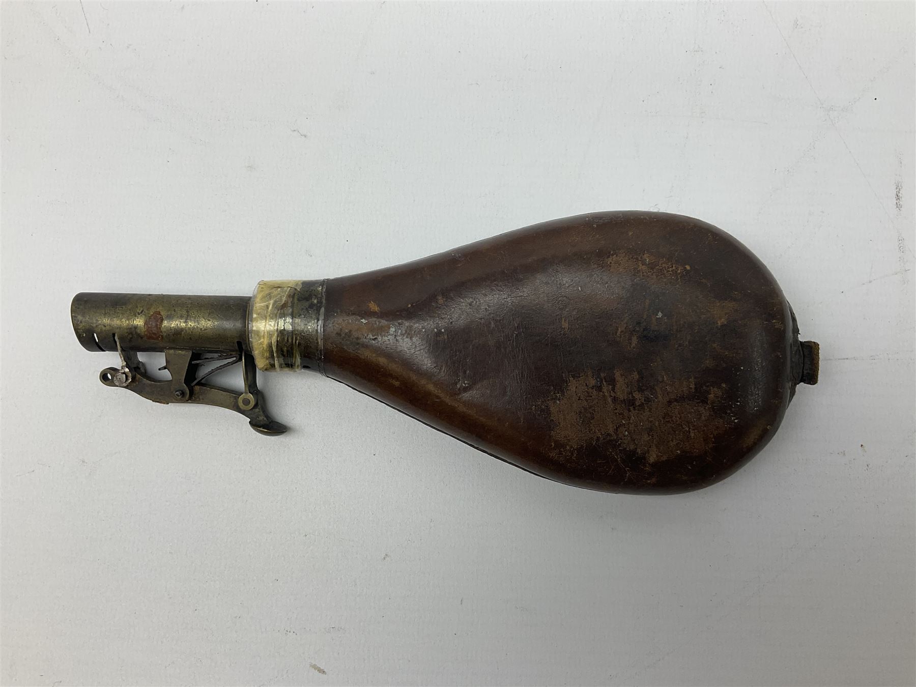 British pattern 1876 socket bayonet with 55cm triangular blade; another smaller socket bayonet; and a leather shot flask, the brass action marked Sykes (3)