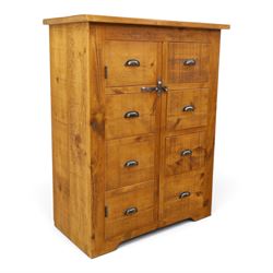 Indigo Furniture - large rustic oak cupboard with faux-drawer fronted cupboard, rectangular top above a cupboard door to the left with latch, a bank of four drawers to the right, metal cup handles raised on shaped supports
