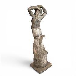 Two composition stone garden figures, comprising a seated boy figure and a standing classical draped female figure, each on square base, weathered painted finish.