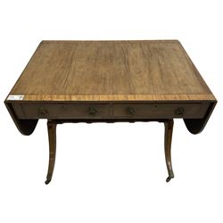 Regency mahogany sofa table, rectangular crossbanded top with twin drop-leaf ends, fitted with single drawer and one faux drawer, raised on shaped end supports united by ring turned stretcher