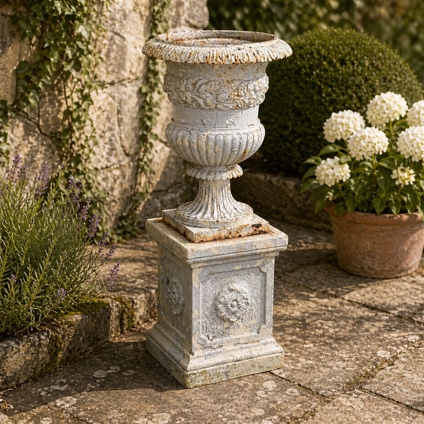 Victorian weathered heavy ornate cast iron garden centerpiece urn, distressed white and duck egg blue painted, raised on square plinth with rose detail 