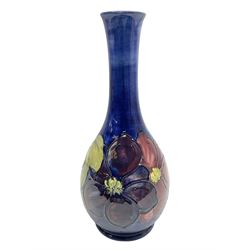 Moorcroft Clematis pattern upon a blue ground, ovoid vase with slender neck, impressed mark beneath, H28cm