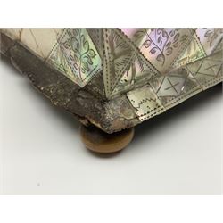 Victorian mother of pearl tea caddy, of rectangular bow-fronted form, the body with floral, bird and geometric engraved mother of pearl panels, white metal shield plaque to the cover inscribed with the initials G.J.A and similar escutcheon, the two division interior with ivory edging and two panelled mother of pearl lids, on four vegetable ivory bun feet L20cm, together with a similar style mother of pearl card case (2) This item has been registered for sale under Section 10 of the APHA Ivory Act