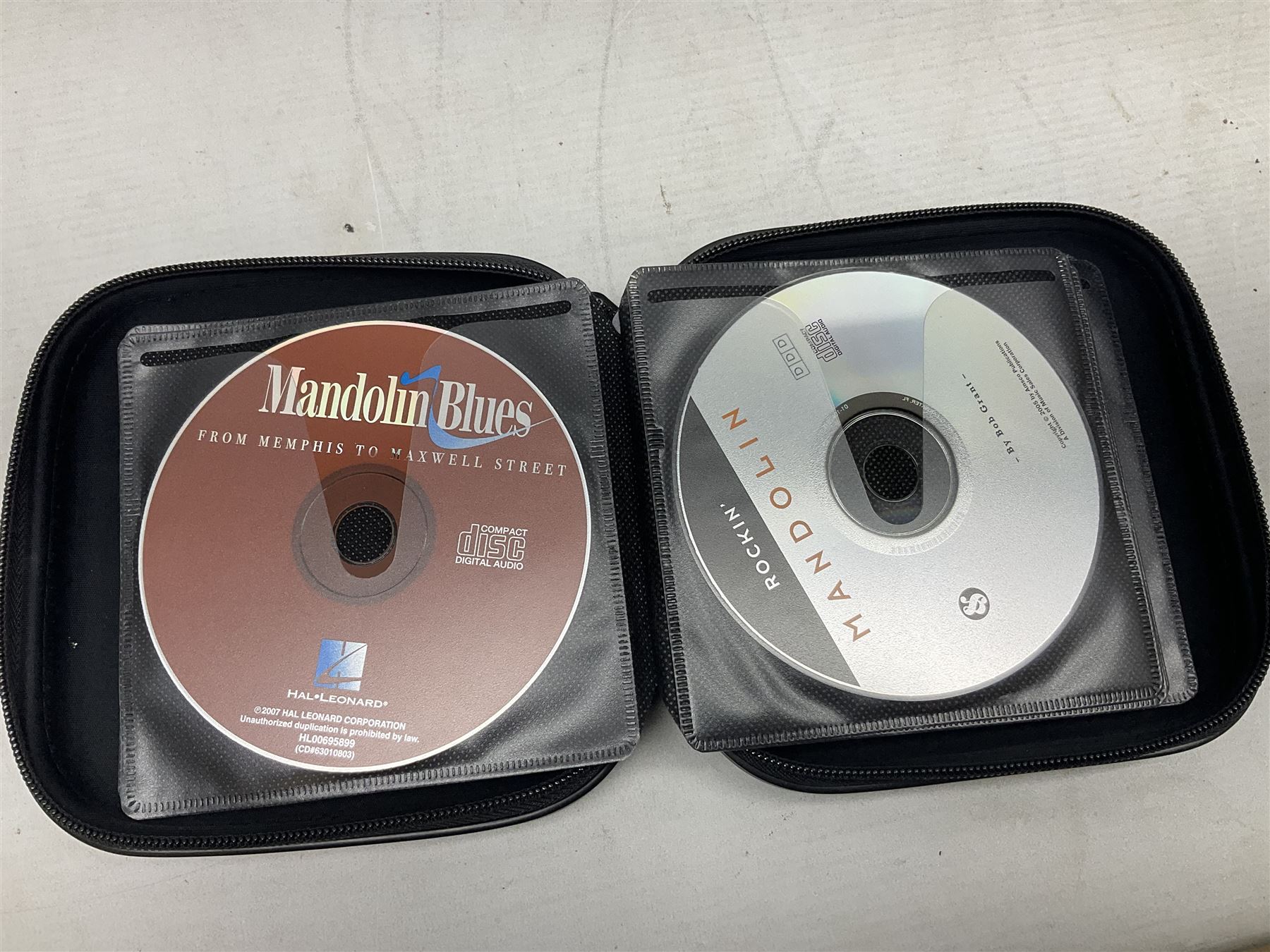 Eastman eight-string mandolin model MD504, serial no.140435406, L66cm; in TGI hard carrying case; together with case of instructional CDs