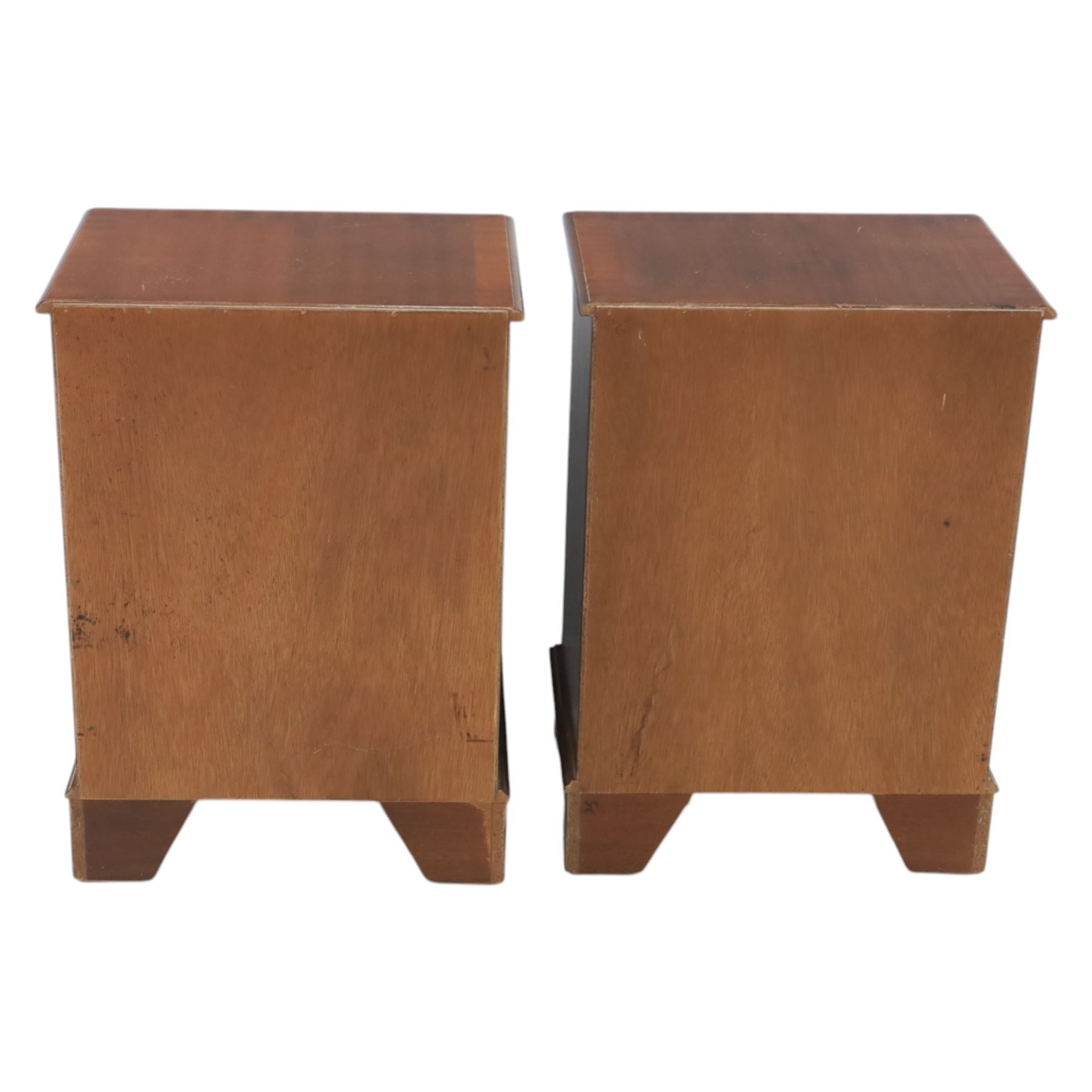 Pair of mahogany bedside lamp tables, fitted with slide, open shelf and three drawers