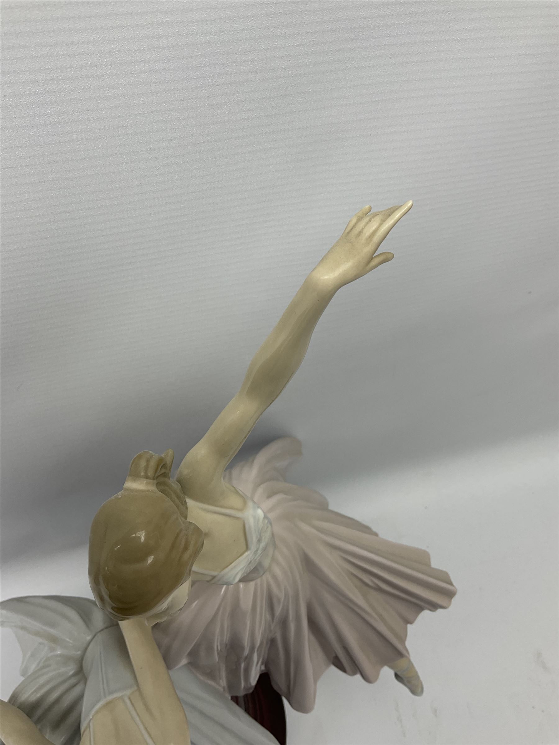 Lladro figure group, 'Merry Ballet', modelled as two ballerinas in dancing pose, raised on a turned socle base, no. 5035, printed marks beneath, H49cm