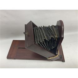 Collation of folding plate cameras of various sizes folding plate in mahogany and lacquered brass, together with camera plates and slides
By vendors repute some slide are from the Gandolfi workshop
