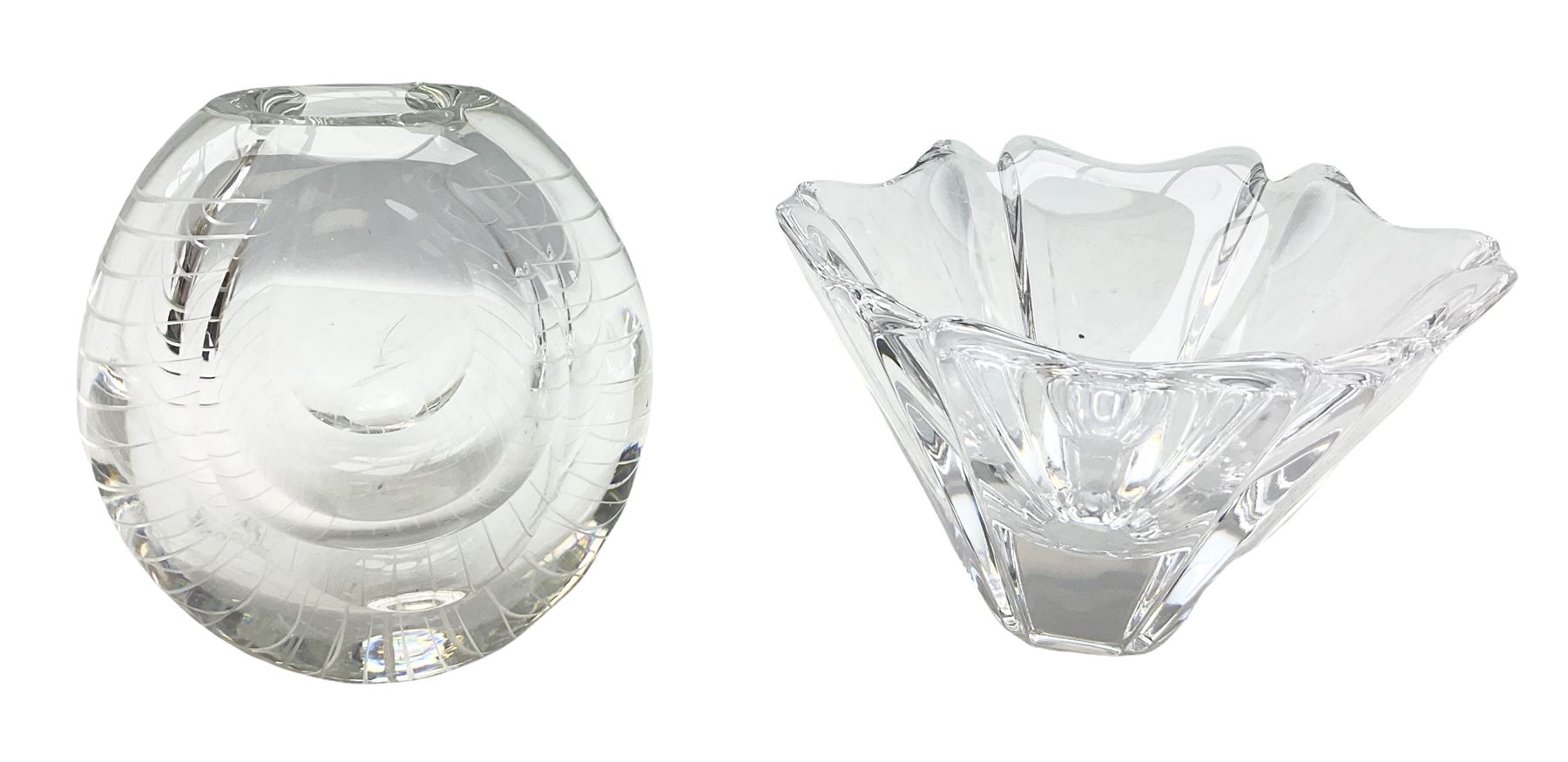 Two Orrefors Art Glass clear glass vases, the first example of compressed circular form, the second of tapering form with lobed rim, each signed beneath, tallest H14.5cm