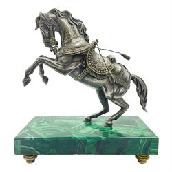  Modern silver model of a rearing horse, with ornate parcel gilt saddle and bridle, mounted upon a rectangular base, decorated with malachite panels to each side and upon four gilt bun feet, horse stamped 925, overall H14.5cm