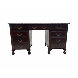 Early to mid 20th century mahogany twin pedestal desk, gardroon carved top with leather inset, fitted with nine drawers