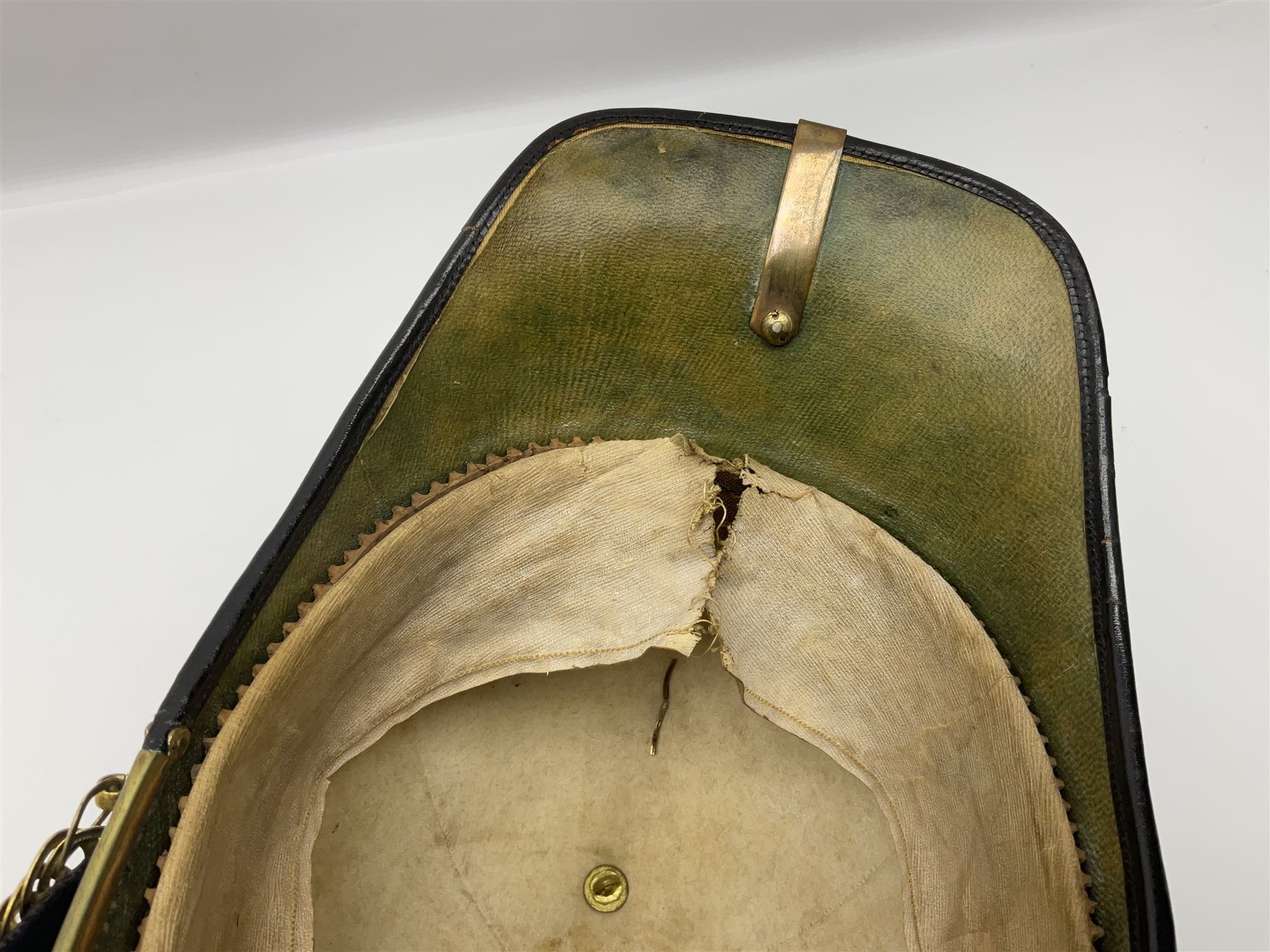 Post-1902 Welsh Regiment Officer's Home Service Blue Cloth Helmet with gilt metal King's crown helmet plate to the front, a removable spike to the top on a shaped cruciform base with rosette fittings, rosette side bosses, brass trim to the front peak, and leather and velvet backed chin scales, with sweat band, the interior with the remains of a makers label at the address 1,3 & 5 Lexington Street, Golden ? London W (presumably Hobson & Sons)
