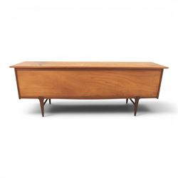 John Herbert for Youngers - 'Fonseca' mid-century teak sideboard, rectangular top above a central bank of three drawers one fitted for cutlery, flanked by cupboards with fixed shelved interior, raised on tapering supports 