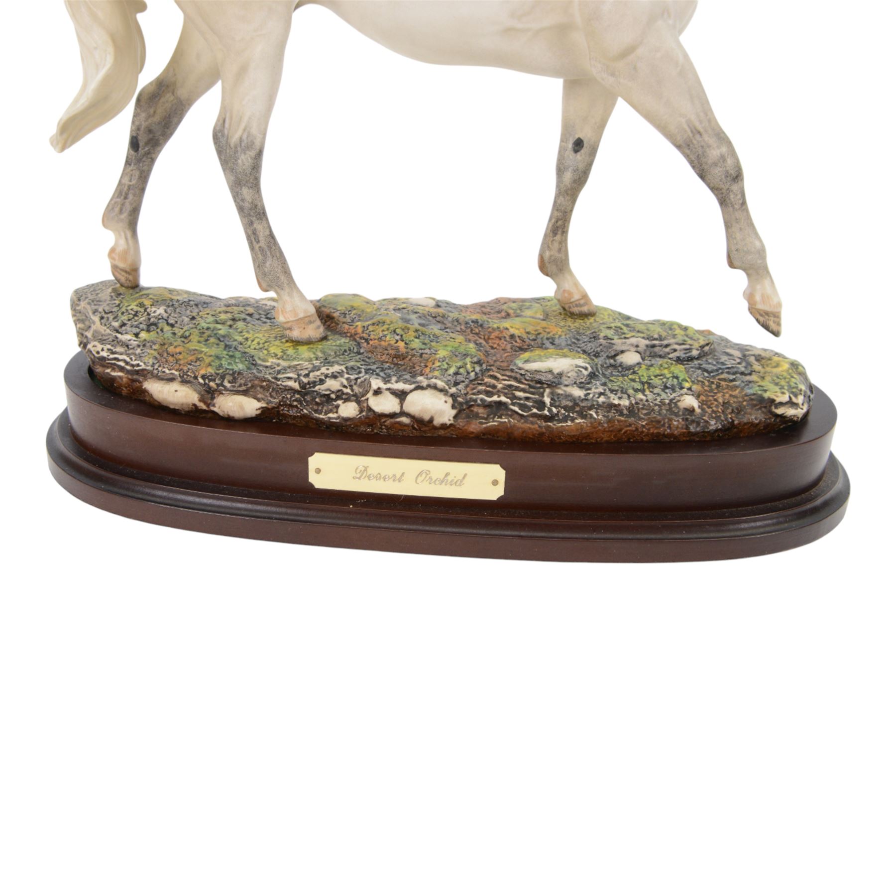 Two Royal Doulton horses, Desert Orchid and Red Rum, on wooden plinths 