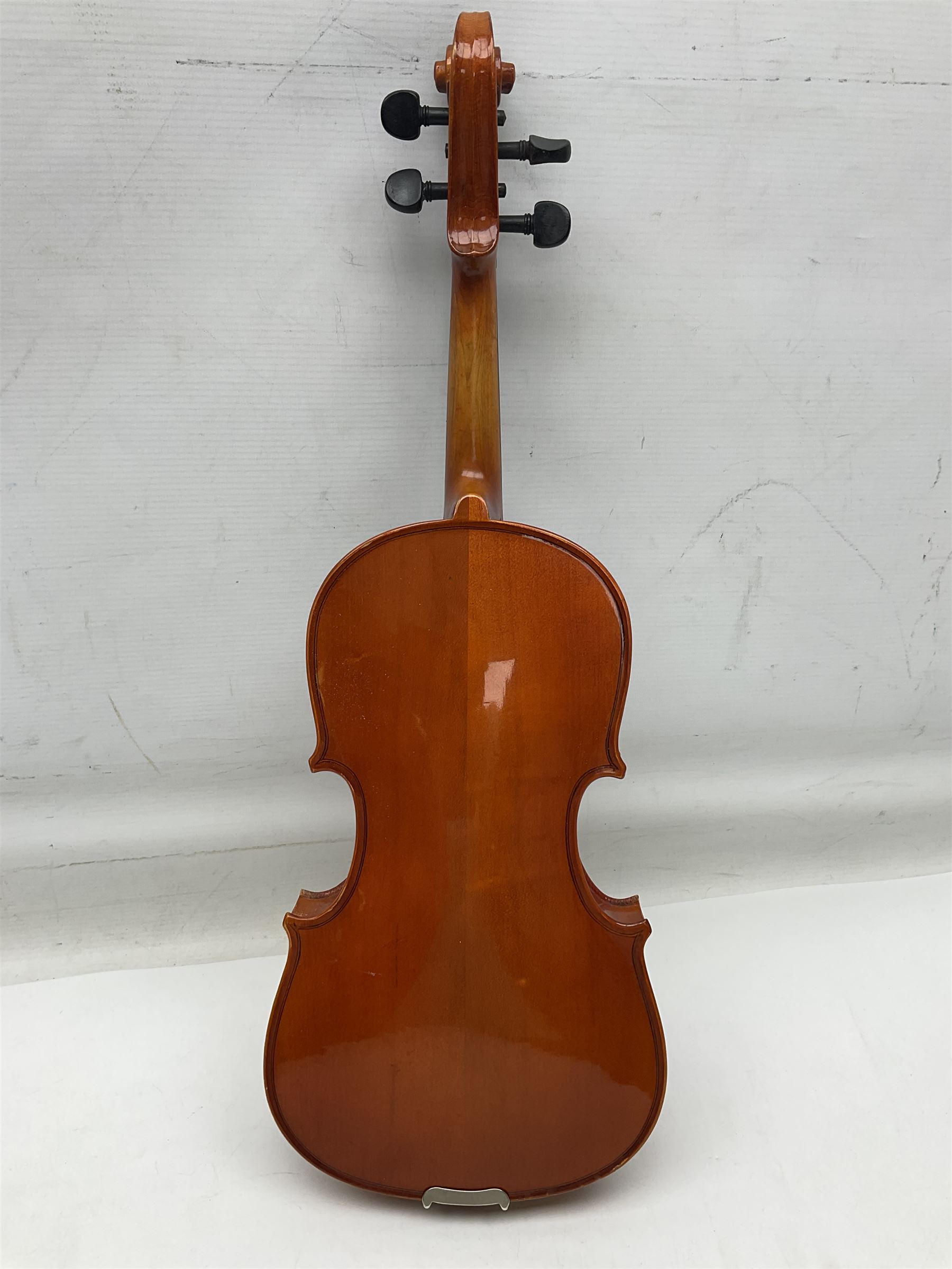 Four student violins - two Chinese three-quarter size with 33.5cm and 34cm two-piece backs; Stringers of Edinburgh quarter size with 28cm two-piece back; and Stentor quarter size with 28cm two-piece back; each in carrying case (4)