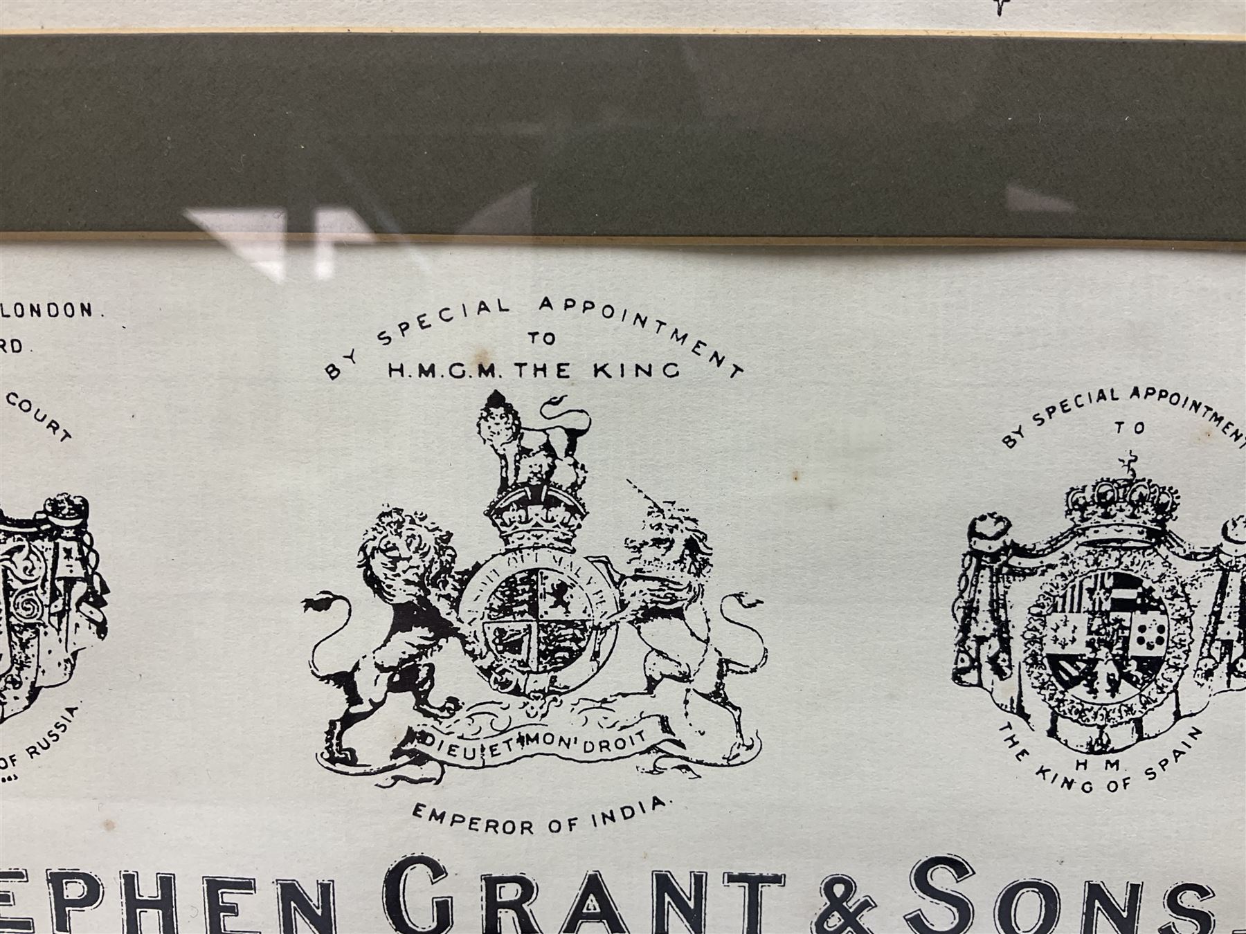 Framed display of three trade gun case labels for Joseph Lang & Son, Henry Atkin and Stephen Grant & Sons, mounted in Hogarth style frame 56 x 25cm