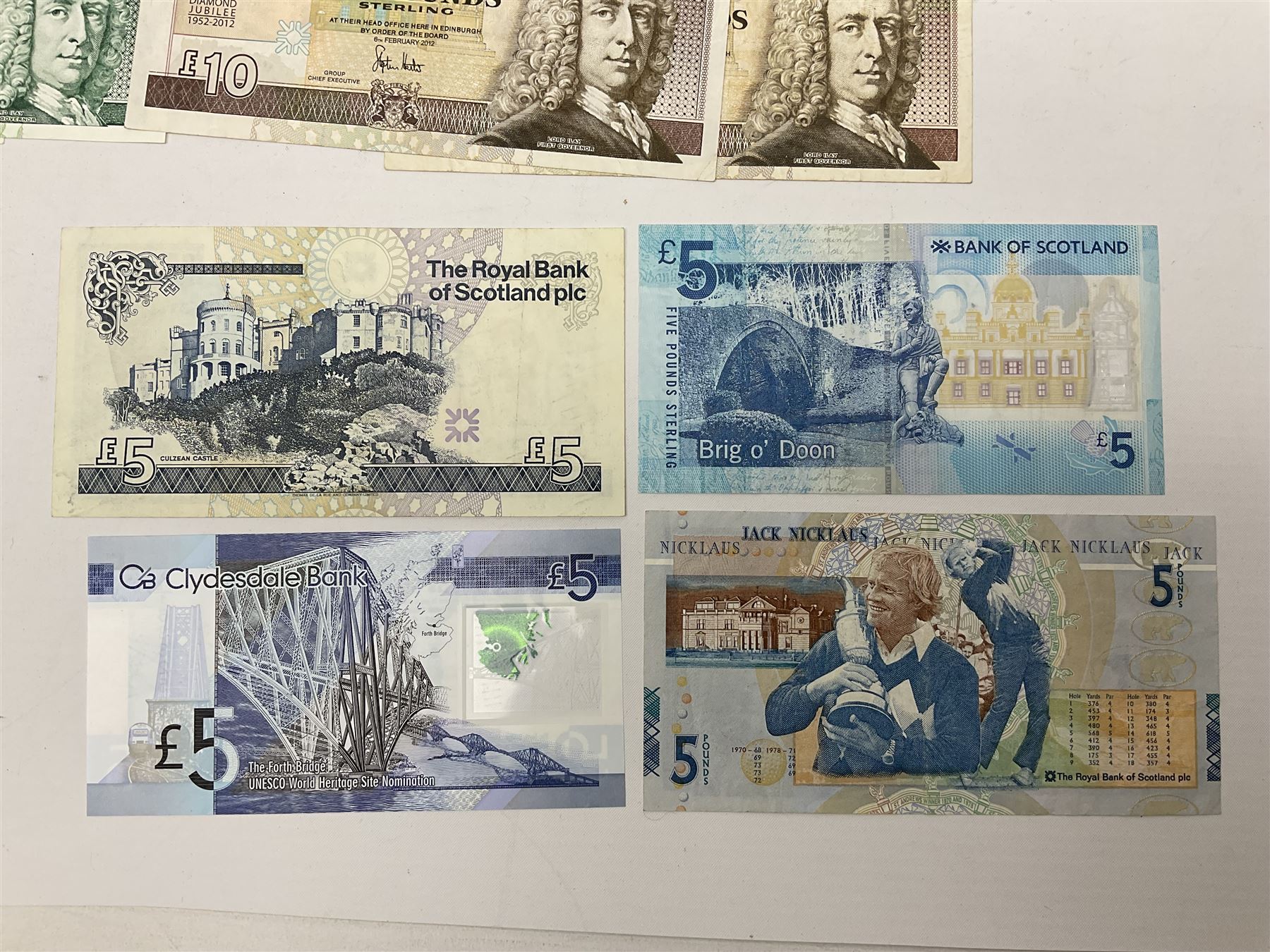 Irish and Scottish banknotes to include Bank of Ireland 5 January 1939 ‘B15’ one pound, two Bank of Scotland 1964 ‘AD07’ and ‘AF05’ one pound notes, one 1966 ‘CQ77’ one pound, and further notes from Clydesdale Bank, National Commercial Bank of Scotland Ltd. etc, housed in plastic sleeves