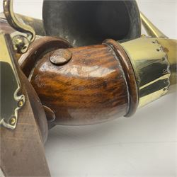 Early 20th century oak and horn dinner bell, the silvered bell suspended from a pair of cow horns, with silver plated mounts and blank shield shaped cartouche, upon square base, H37cm
