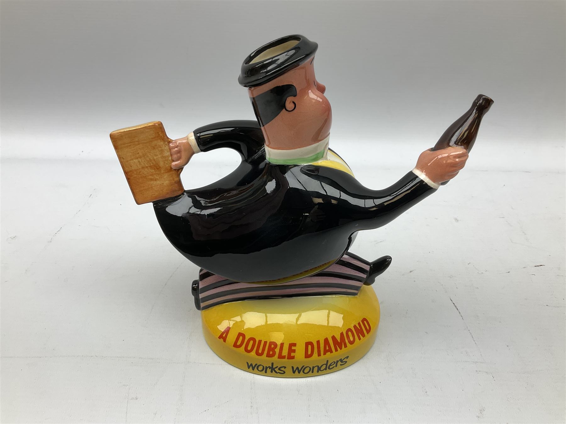 Beswick 'Double Diamond Works Wonders' advertising decanter in the form of a business man with briefcase and bottle, with impressed and printed marks beneath