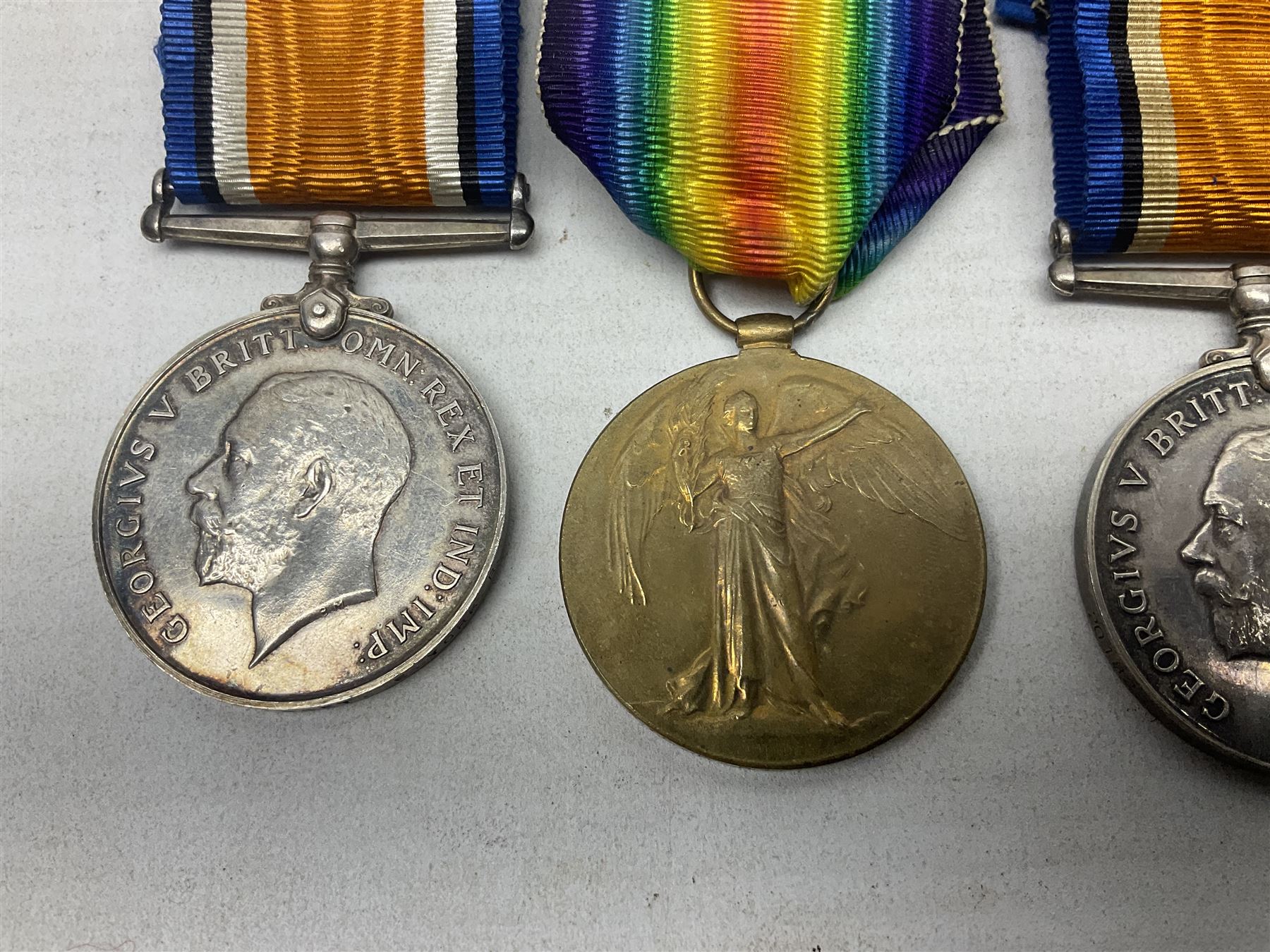 Family group of five WW1 medals for the East Yorkshire regiment comprising trio of 1914-15 Star, British War Medal and Victory medal awarded to 13-368 Pte. C. Padget; and British War Medal and Victory Medal to 201829 Pte. H.W. Padget; all with ribbons (5)