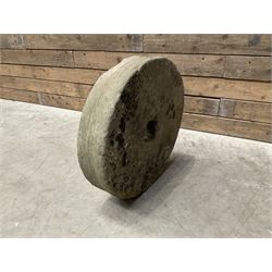 19th century circular stone mill wheel,