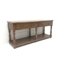  20th century medium oak dresser base, moulded top above two drawers, baluster supports joined by potboard base, W180cm, H79cm, D50cm  